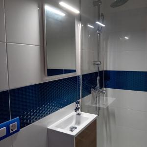 a bathroom with a sink and a mirror at María PLAYA 1 NG in Peniscola