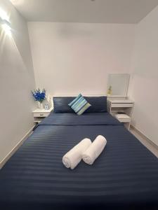 Postel nebo postele na pokoji v ubytování Lilys Homestay By Dhalhey's