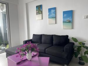 Posezení v ubytování Lilys Homestay By Dhalhey's + 2 fotografie