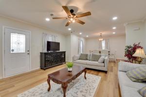 a living room with a couch and a ceiling fan at Walking Distance to Casino Home in Westlake! in Westlake