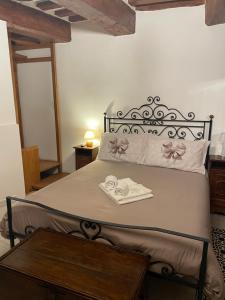 A bed or beds in a room at Affittacamere Mirella