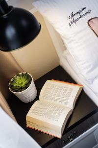 Posteľ alebo postele v izbe v ubytovaní Imagine Apartments