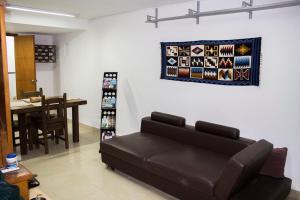 a living room with a couch and a table at La Palma Paradise 1 in Medellín