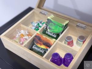 a drawer with some food and drinks in it at RentHouse Apartments-Old Town Studio #2 in Chişinău