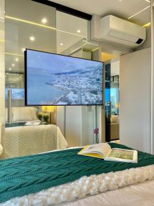 Ένα ή περισσότερα κρεβάτια σε δωμάτιο στο Apto de Luxo Vista de Alpha