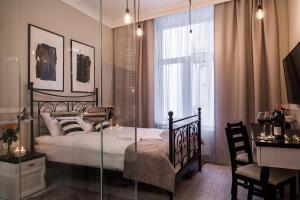 Posteľ alebo postele v izbe v ubytovaní Imagine Apartments