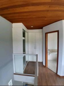 a kitchen with a glass counter in a room at Casa da Amandinha in Florianópolis