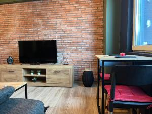 Televisyen dan/atau pusat hiburan di Mickitos Apartments - Mavrovo