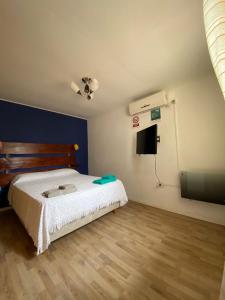 En eller flere senge i et værelse på Dpto Stairs Nova