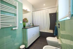 a bathroom with a toilet and a sink at Lisbon Casa da Clementina - a Serene Garden Stay in Lisbon +83 photos