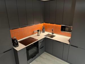 Kuchyň nebo kuchyňský kout v ubytování ACCOMMODO192 + 37 fotografií