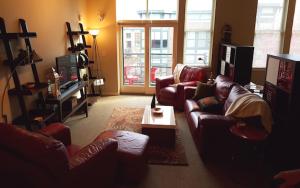 a living room with couches and a coffee table at Orenco Lofts in Hillsboro