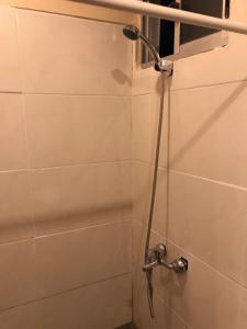 a shower in a bathroom with a shower head at Rancho aparte in Barra de Valizas