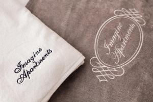 Certifikát, ocenenie alebo iný dokument vystavený v ubytovaní Imagine Apartments