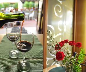a bottle of wine being poured into a wine glass at Pacific Pensionne in Cebu City