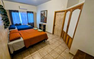 Voodi või voodid majutusasutuse Guamacayan House toas