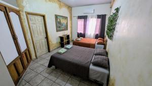 Postel nebo postele na pokoji v ubytování Guamacayan House + 20 fotografií