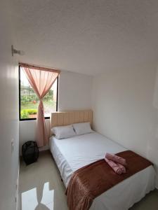 Ένα ή περισσότερα κρεβάτια σε δωμάτιο στο S91 Apartamento