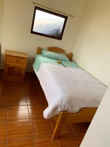 Postel nebo postele na pokoji v ubytování Hostal Rumyhuasy