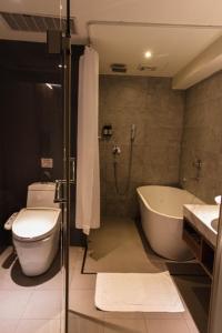 Koupelna v ubytování 新麗旅店 Newful Hotel + 35 fotografií