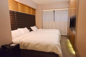新麗旅店 Newful Hotel 객실 침대