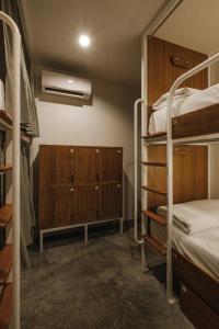 Ein Bett oder Betten in einem Zimmer der Unterkunft Hidden Garden Hostel
