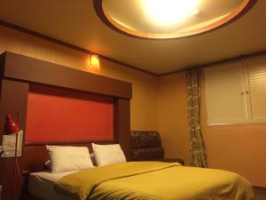 Postel nebo postele na pokoji v ubytování Prince Hotel