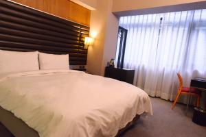新麗旅店 Newful Hotel 객실 침대