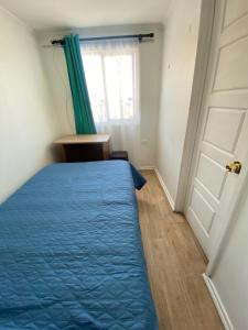 a bedroom with a bed and a window and a door at Barros Borgoño 2 Departamento in Valparaíso +18 photos