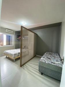 Ένα ή περισσότερα κρεβάτια σε δωμάτιο στο Apartamento Torres Center +6 φωτογραφίες