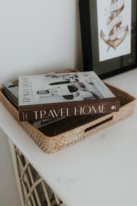two books sitting on top of a table at The Boatshed Big Manly in Whangaparaoa +8 photos