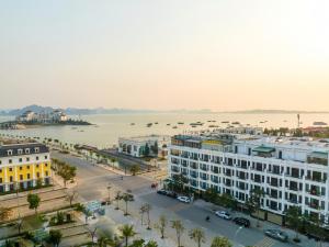an aerial view of a city with a body of water at Kim Sentral Hotel in Ha Long