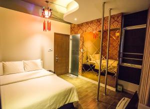 Postel nebo postele na pokoji v ubytování Bonita Grand Hotel