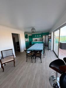 a dining room with a table and chairs in a room at Vista al mar turquesa de Bahia in Calderilla +9 photos
