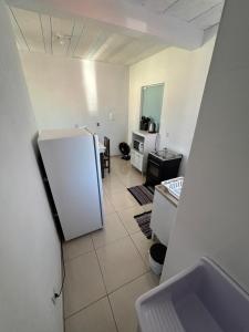 Η κουζίνα ή μικρή κουζίνα στο Apartamento Imbituba +2 φωτογραφίες