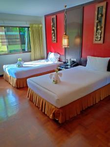 Katil atau katil-katil dalam bilik di Suan Bua Hotel & Resort