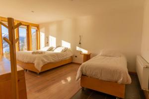 Ένα ή περισσότερα κρεβάτια σε δωμάτιο στο Errante Ecolodge