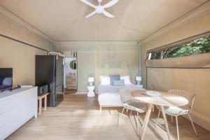 a living room with a bed and a table at Reflections North Haven - Holiday Park in North Haven