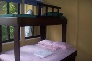 Voodi või voodid majutusasutuse Cabinas surf Arribadas toas