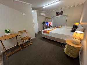 Postel nebo postele na pokoji v ubytování Kalua Motel