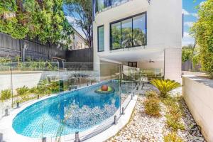 a house with a swimming pool in a yard at Harbour view new year firework in Sydney