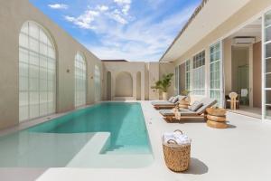 an indoor swimming pool in a house at Sonata Koh Samui in Koh Samui 