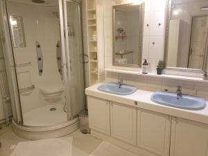 a bathroom with two sinks and a shower at Holiday Home Villa Gol in Gol +51 photos