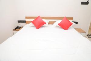 Postel nebo postele na pokoji v ubytování Coconad Resort