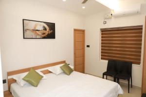 Postel nebo postele na pokoji v ubytování Coconad Resort