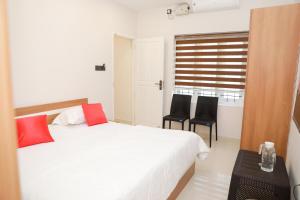 Postel nebo postele na pokoji v ubytování Coconad Resort
