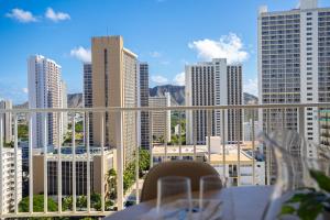 a table with a view of a city skyline at Stylish Studio with Great Ocean Views & Near Beach! in Honolulu