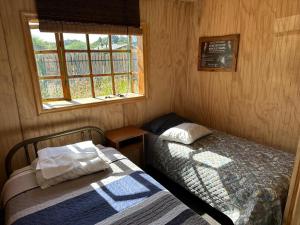 Postel nebo postele na pokoji v ubytování Cabañas Alelí