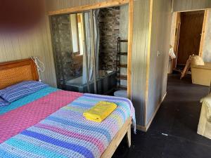 Postel nebo postele na pokoji v ubytování Cabañas Alelí