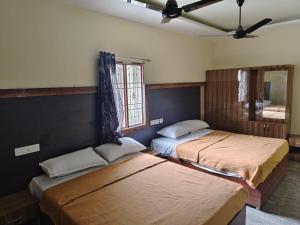 Postel nebo postele na pokoji v ubytování MOUNT OASIS tvm